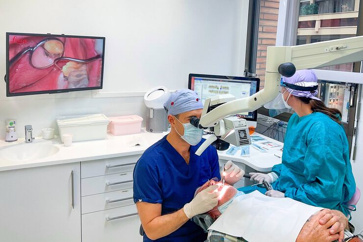 Dr. Blanc using the M320 dental microscope with ultra-low binoculars